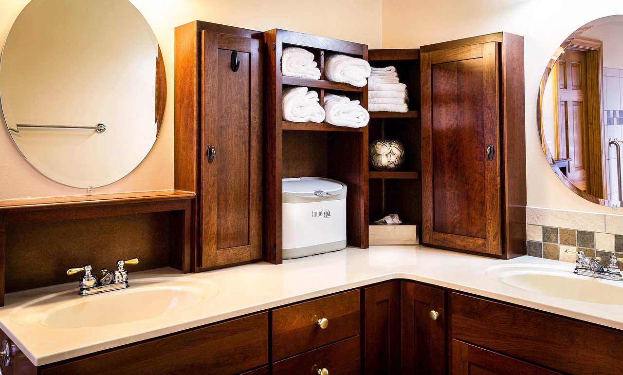 Wood bathroom vanity with a white countertop and vessel sink